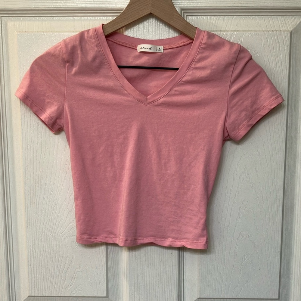 Pink crop top.